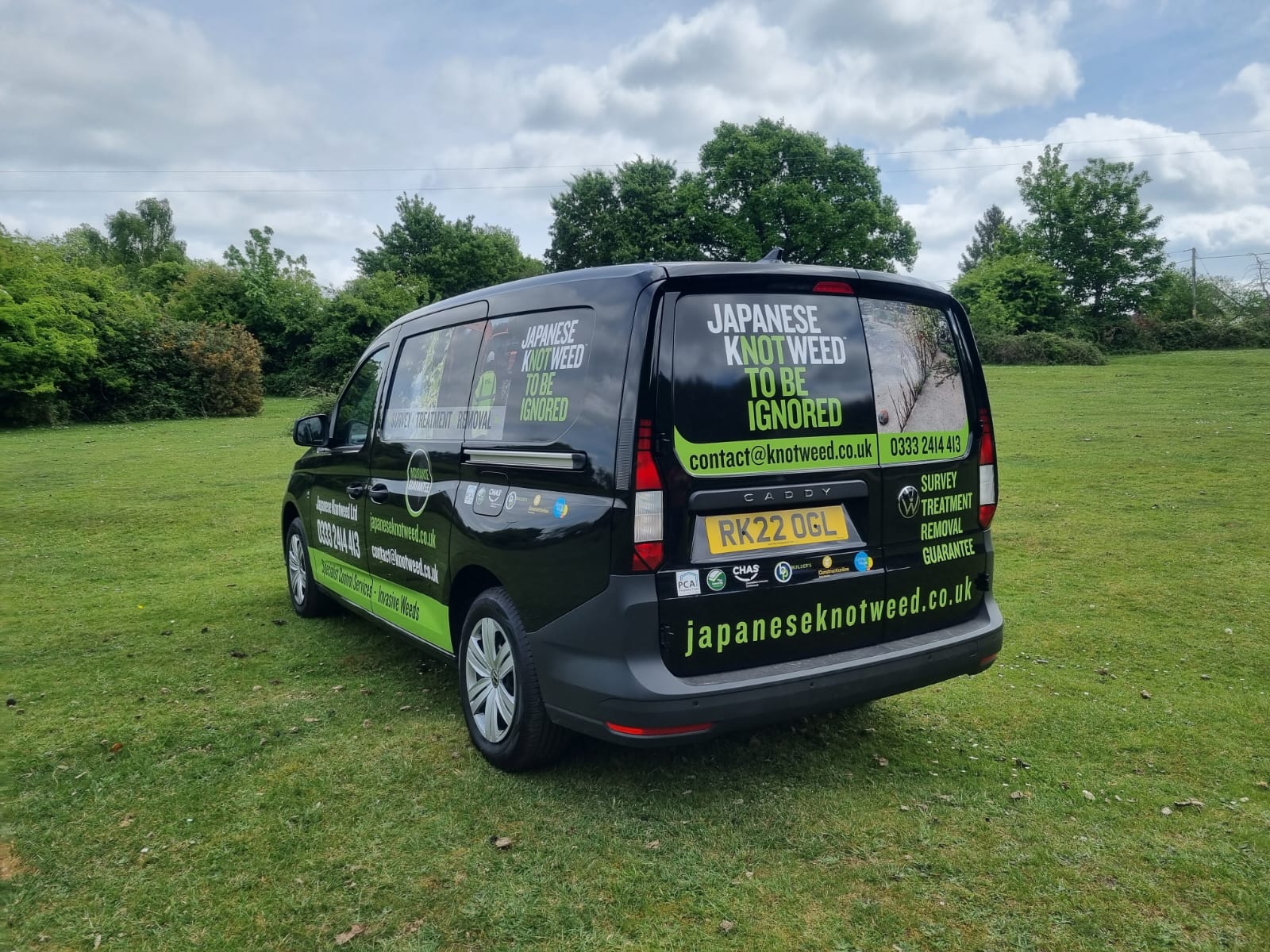 Rear view of a Japanese knotweed ltd. company vehicle