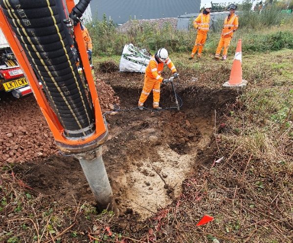 Vacuum excavator drilling into the ground