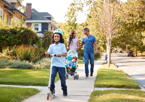 Family walkign around their residential estate