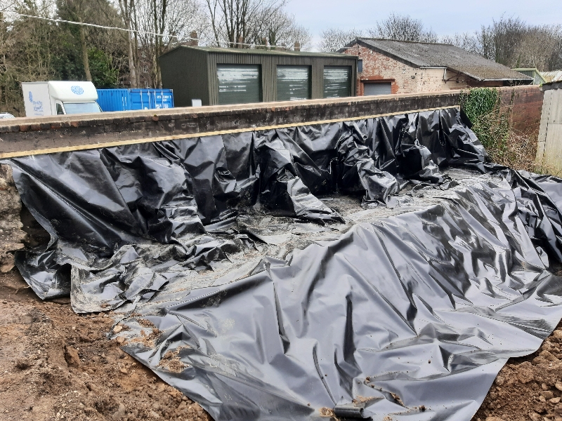 Plastic sheeting creating a root barrier