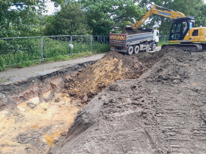 Soil excavated from ground and loaded into tipper lorry